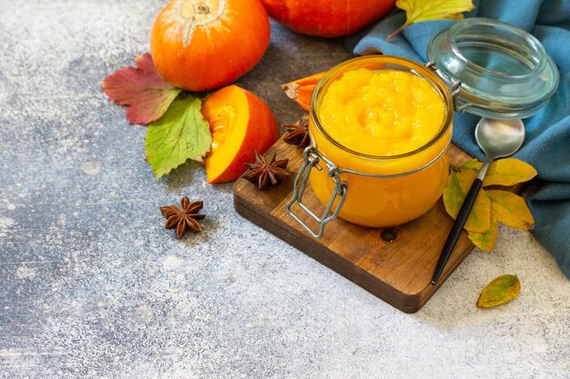 Autumn pumpkin meals for thanksgiving day Pumpkin Puree on a slate background Copy space