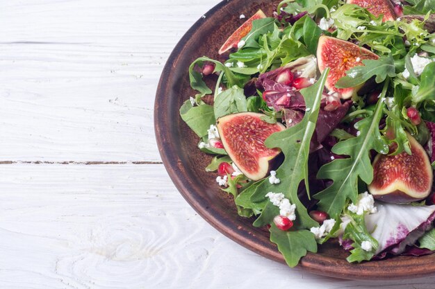 Autumn salad with arugula spinach figs and cheese