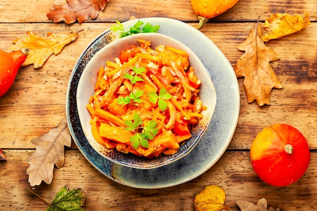 Autumn salad with pumpkin and pork ears