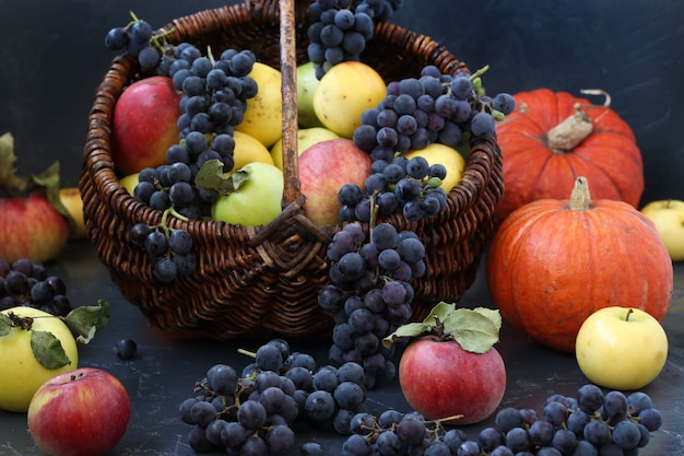 Autumn still life with apples, grapes and pumpkin