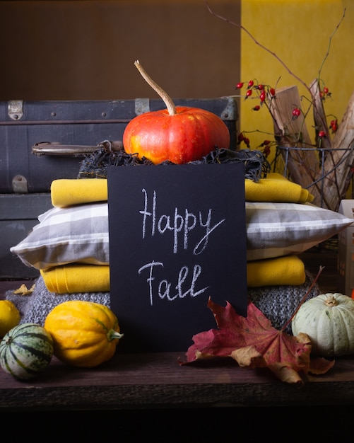 Autumn still life with pumpkins and candles