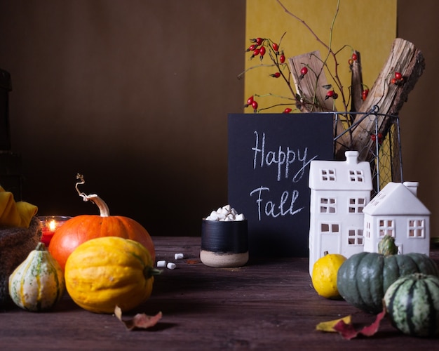 Autumn still life with pumpkins and candles