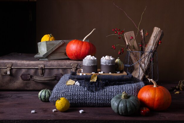 Autumn still life with pumpkins and candles