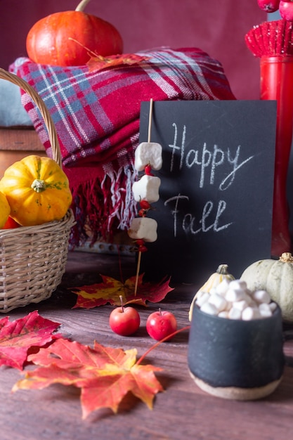 Autumn still life with pumpkins and plaids