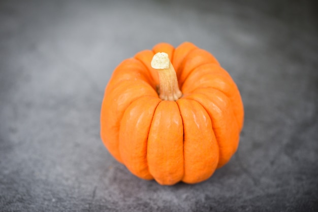 Autumn table setting with pumpkins holidayThanksgiving  decoration festive or halloween dark  