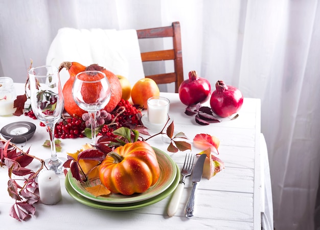 Autumn table setting with pumpkins.