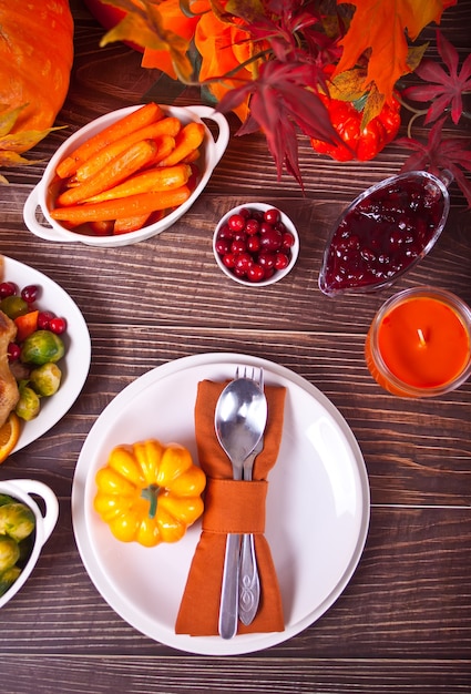 Autumn table setting with pumpkins.