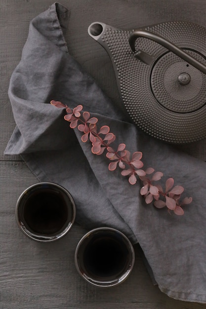 autumn tea in minimalist style. black teapot in Asian style 