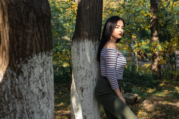 Autumn woman portrait outdoors at the park