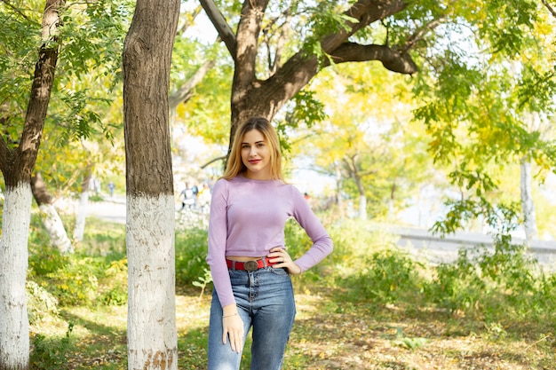 Autumn woman portrait outdoors at the park