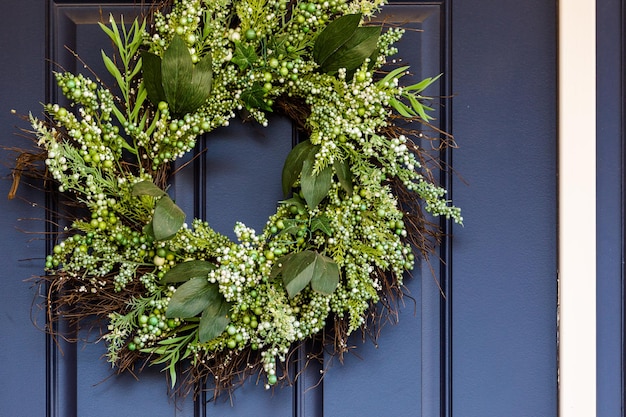 Autumn wreath decorating front door.