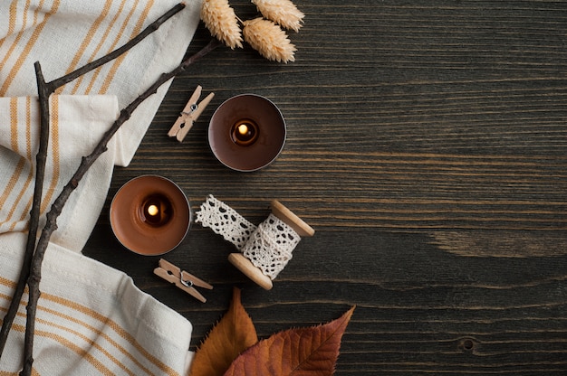 autumnal composition with leaves and candles