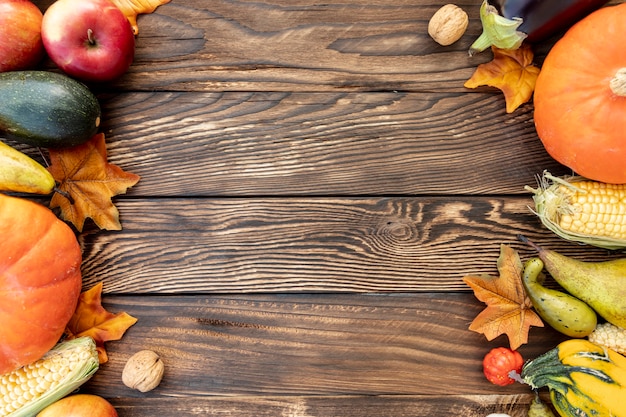 Autumnal frame on wooden table with copy space 