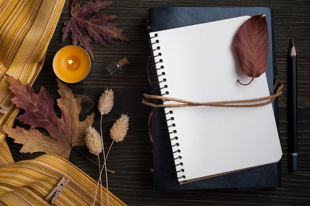 Autumnal leaves and lit candles