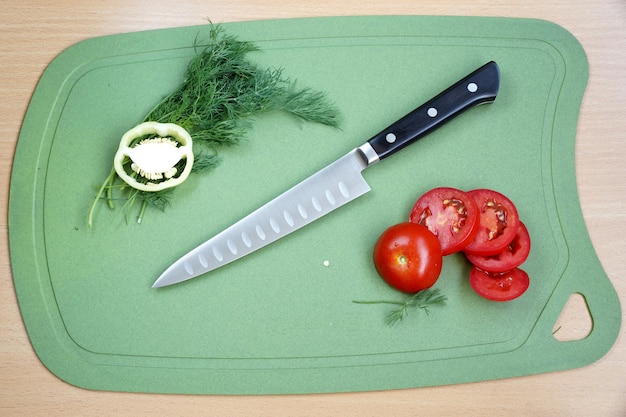 Average utility knife a chopping board