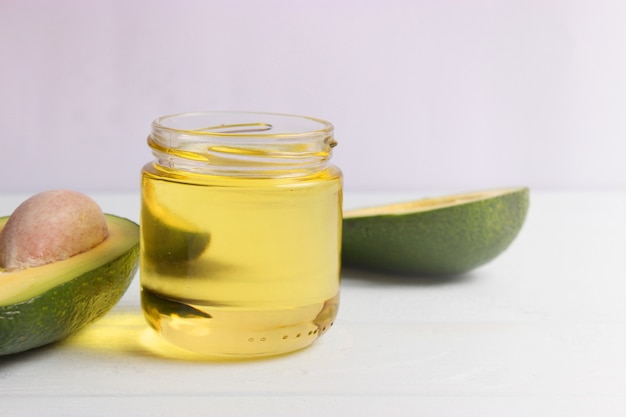 Avocado and avocado oil close up on the table