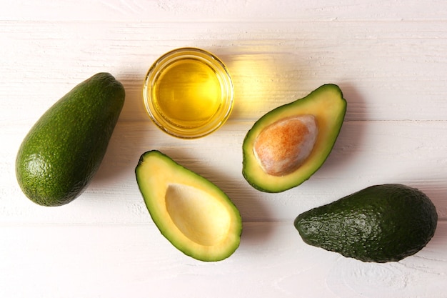 Avocado and avocado oil close up on the table