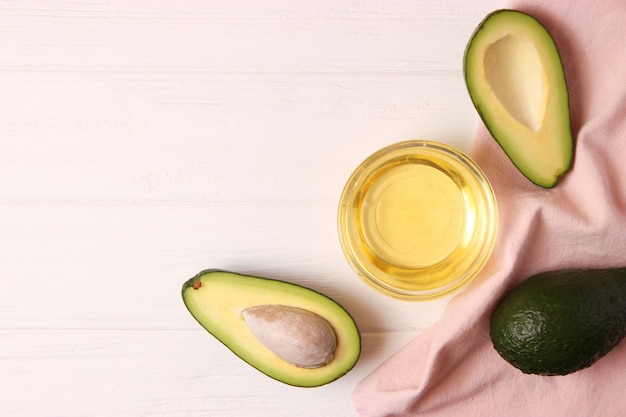 Avocado and avocado oil close up on the table