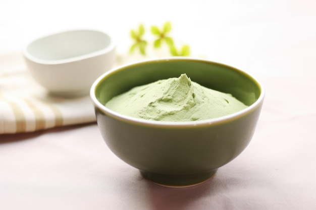 Avocado and avocadobased face mask in a ceramic bowl