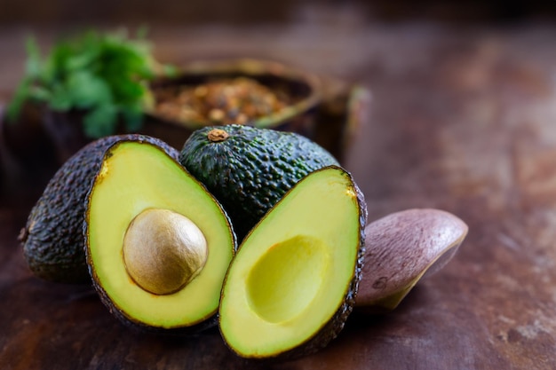 Avocado in basket isolated on white with vitamin B