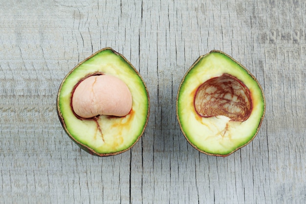 avocado cut on wooden floor.