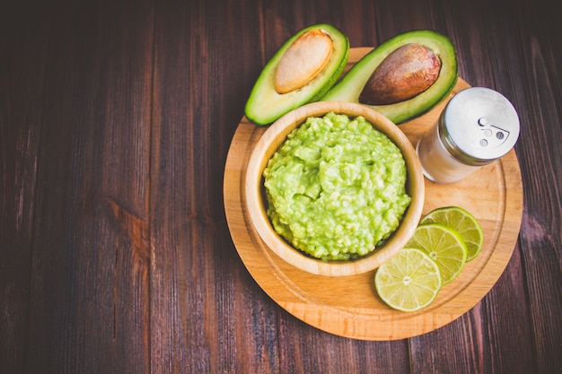 Avocado Guacamole on molcajete real Mexican traditional procedure