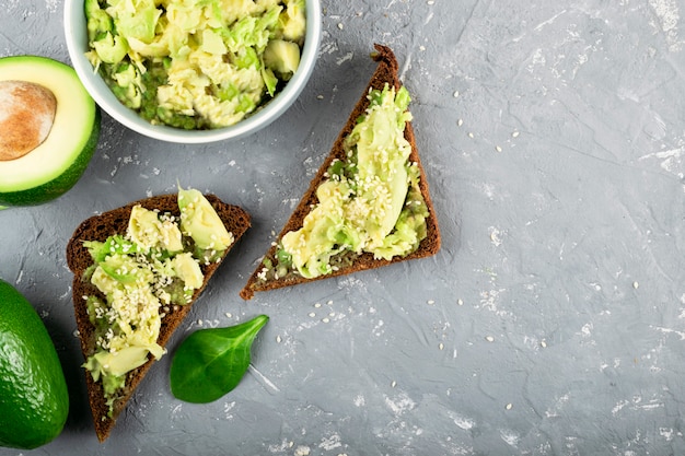 Avocado and guacamole sauce. Snack. Fresh vegetables and spinach