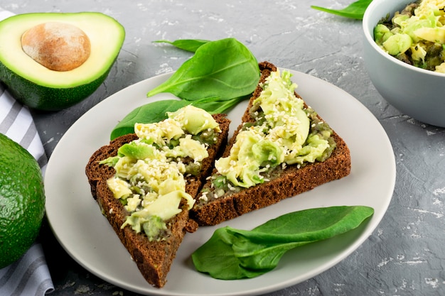 Avocado and guacamole sauce. Snack. Fresh vegetables and spinach