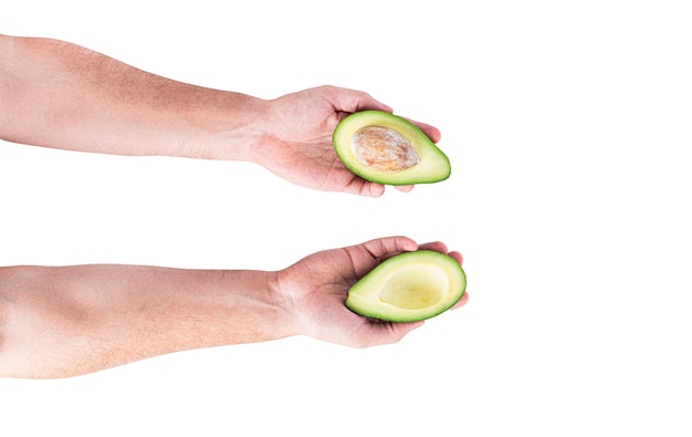 Avocado in de hand geïsoleerd op een witte achtergrond. Hoge kwaliteit foto