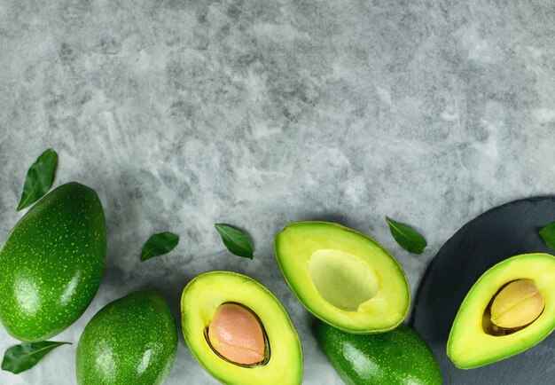 avocado and leaf top view on marble table