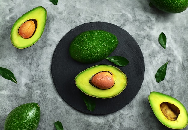 avocado and leaf top view on marble table