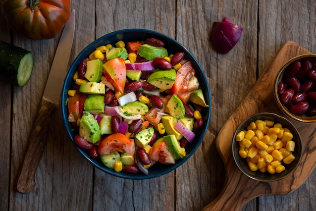 Avocado salad with other vegetables tomatoes and corn Healthy food