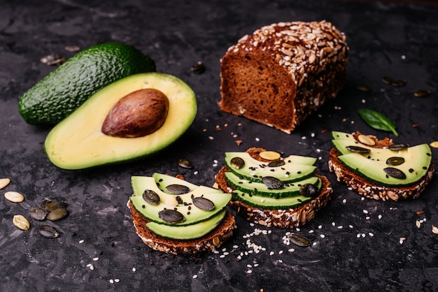 Avocado sandwiches with seeds, sesame and a lime 