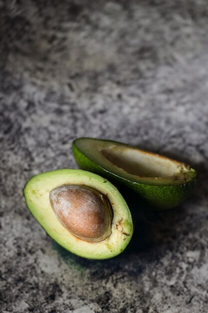 Avocado slice on rustic wood