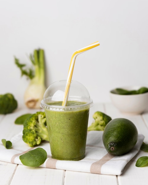 Avocado smoothie in plastic cup