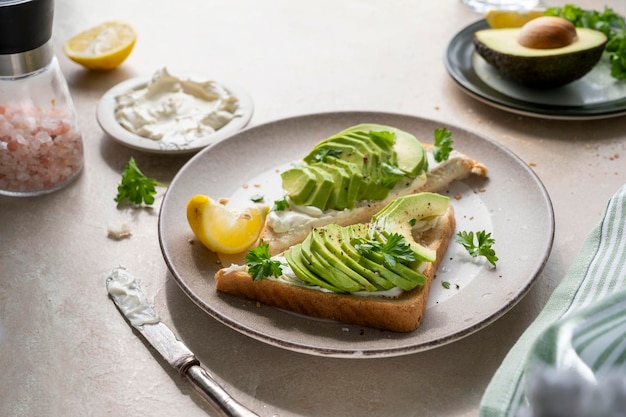 Avocado toast with cream cheese lemon and herbs Homemade healthy food