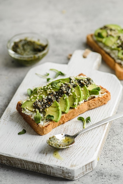 Avocado toast with pesto sauce