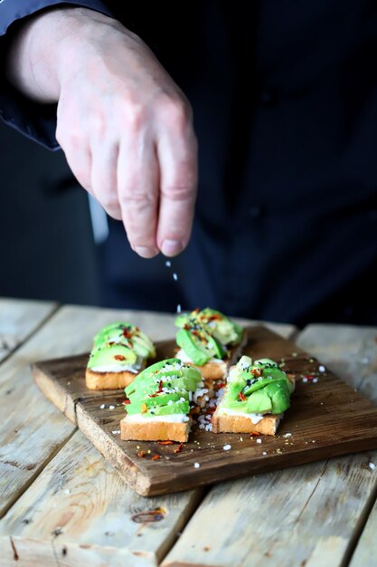 avocado toasts on a wooden board