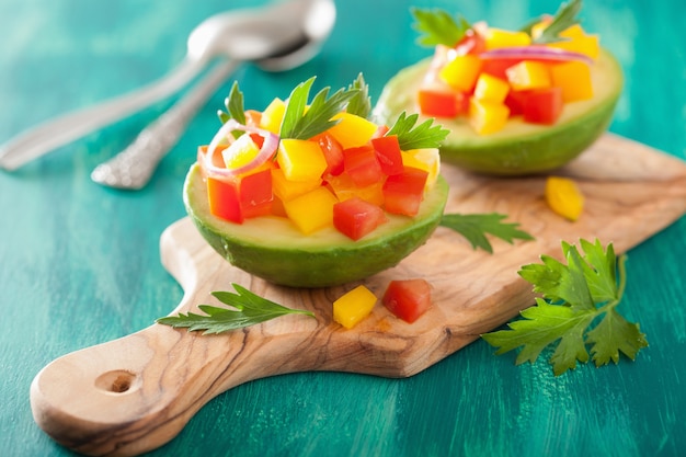 Avocados stuffed with tomato pepper salad