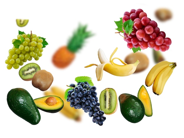 Avokado grape kiwi banan ananas levitate on a white background healthy diet Fresh fruits and vegetables