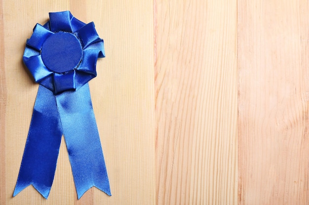 Award ribbon on wooden background