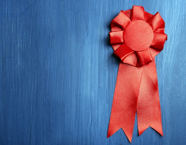 Award ribbon on wooden background