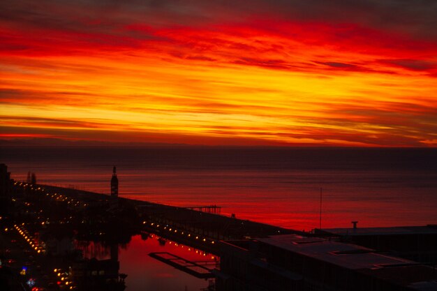 Awesome, incredible beautiful red, pink vivid sunset landscape in the evening in the city. Sunset sky texture and surfce. Beauty nature