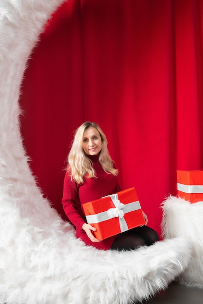 Awesome pretty cute pretty girl getting ready for christmas and new year, posing against new year background