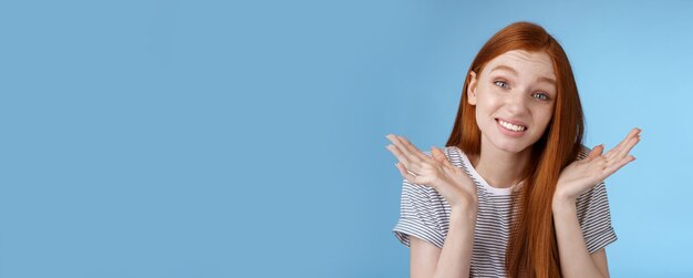 Photo awkward apologizing cute redhead girlfriend say sorry shrugging spread hands sideways puzzled