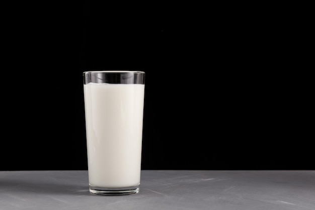 Photo ayran kefir in tall glass on black background fermented milk ayran milk diet for weight loss