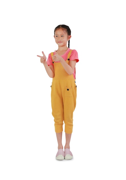 Aziatische meisje jongen gebaar vinger wijzen en kijken naast geïsoleerd op witte achtergrond Afbeelding volledige lengte met uitknippad