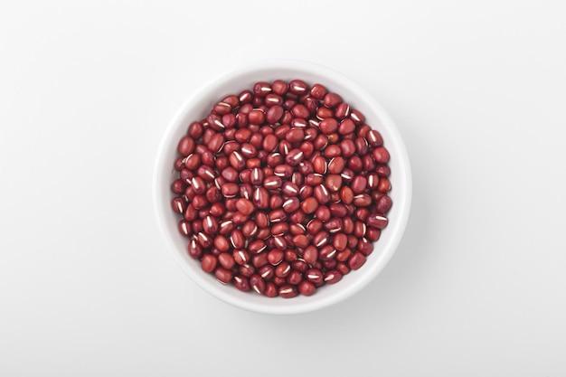 Azuki red bean in white bowl on white background