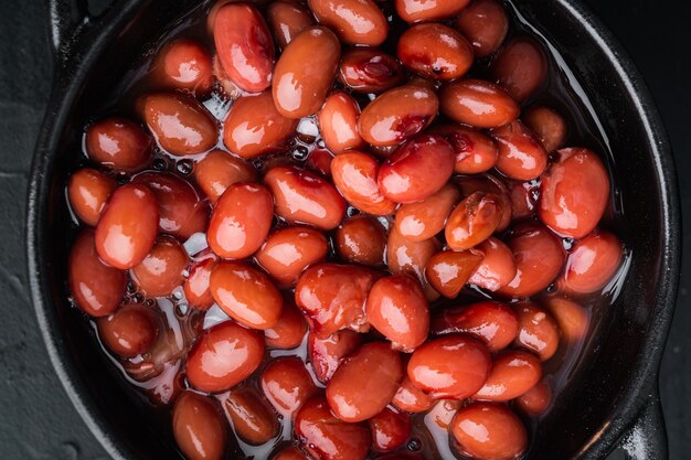 Azuki red beans, on black table, top view flat lay