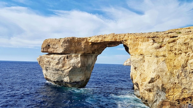 Azure window on mediterranean sea against sky at gozo island